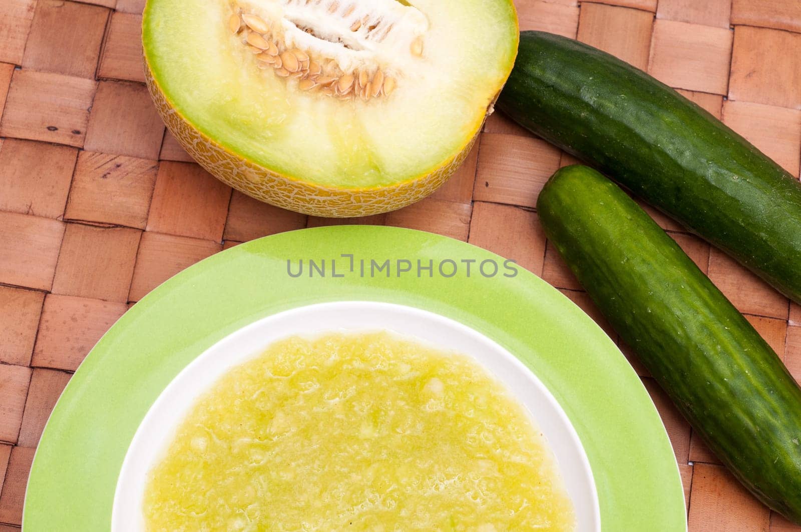Cold soup in a plate with fruits and vegetables