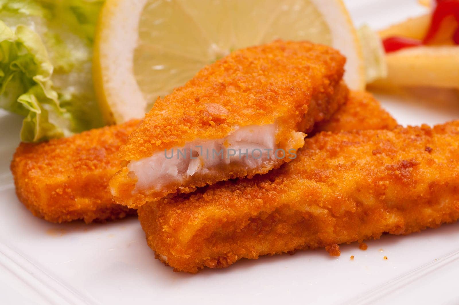 Close-up of fast food fried fish fingers