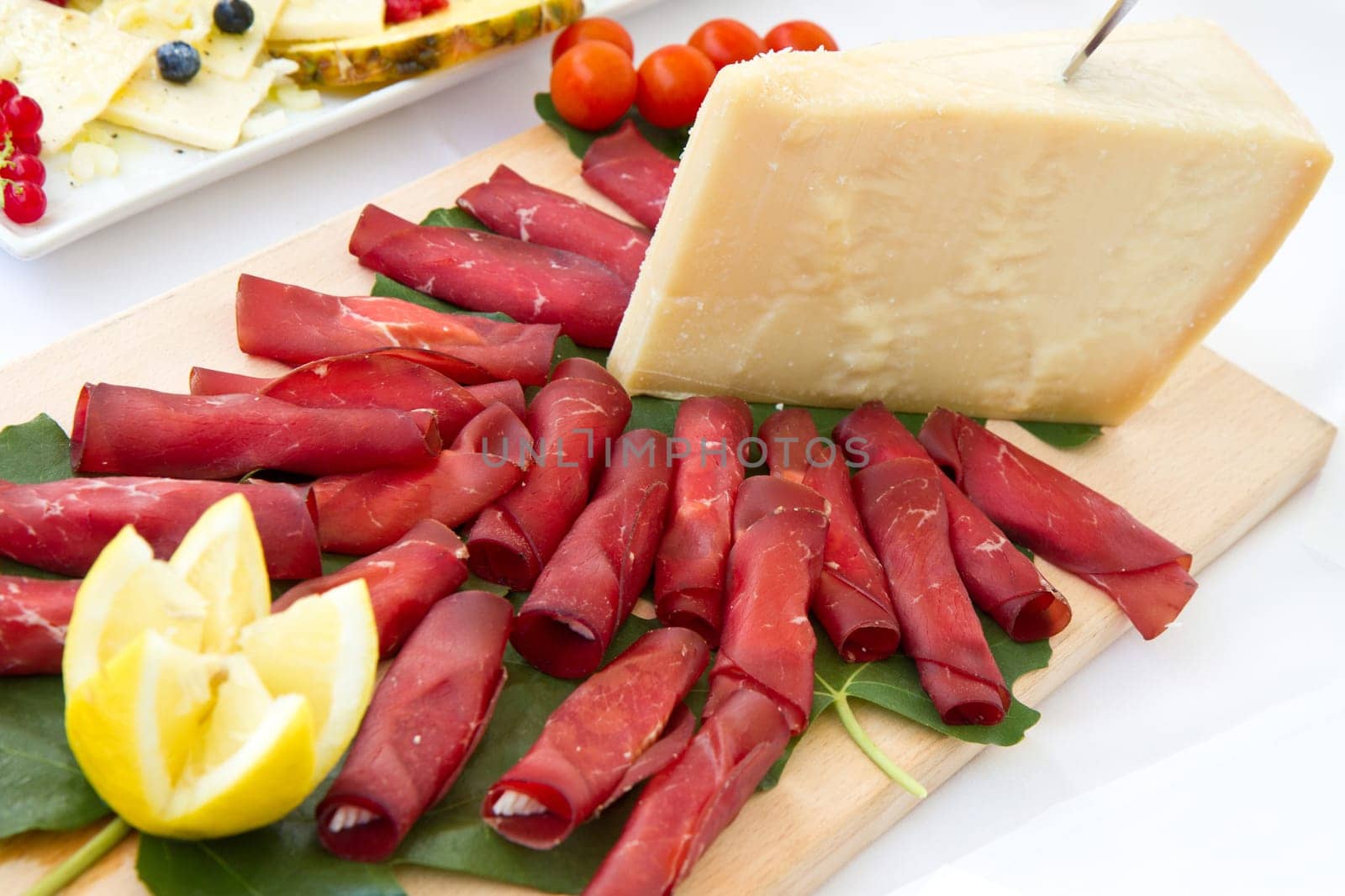 Italian appetizer with bresaola and parmesan cheese