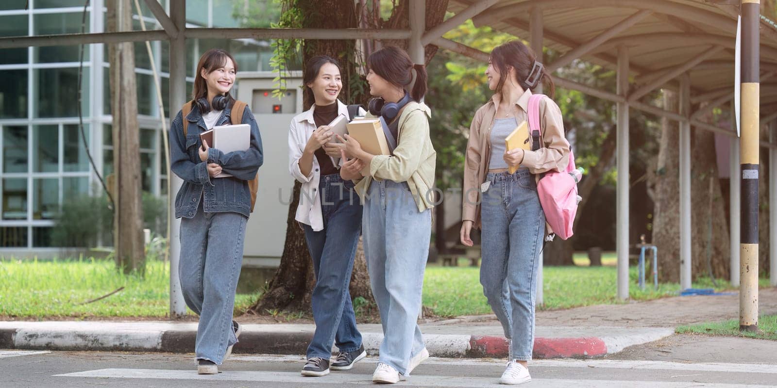 Group of Young Asian student walking and talking at university before class room. education, back to school concept.