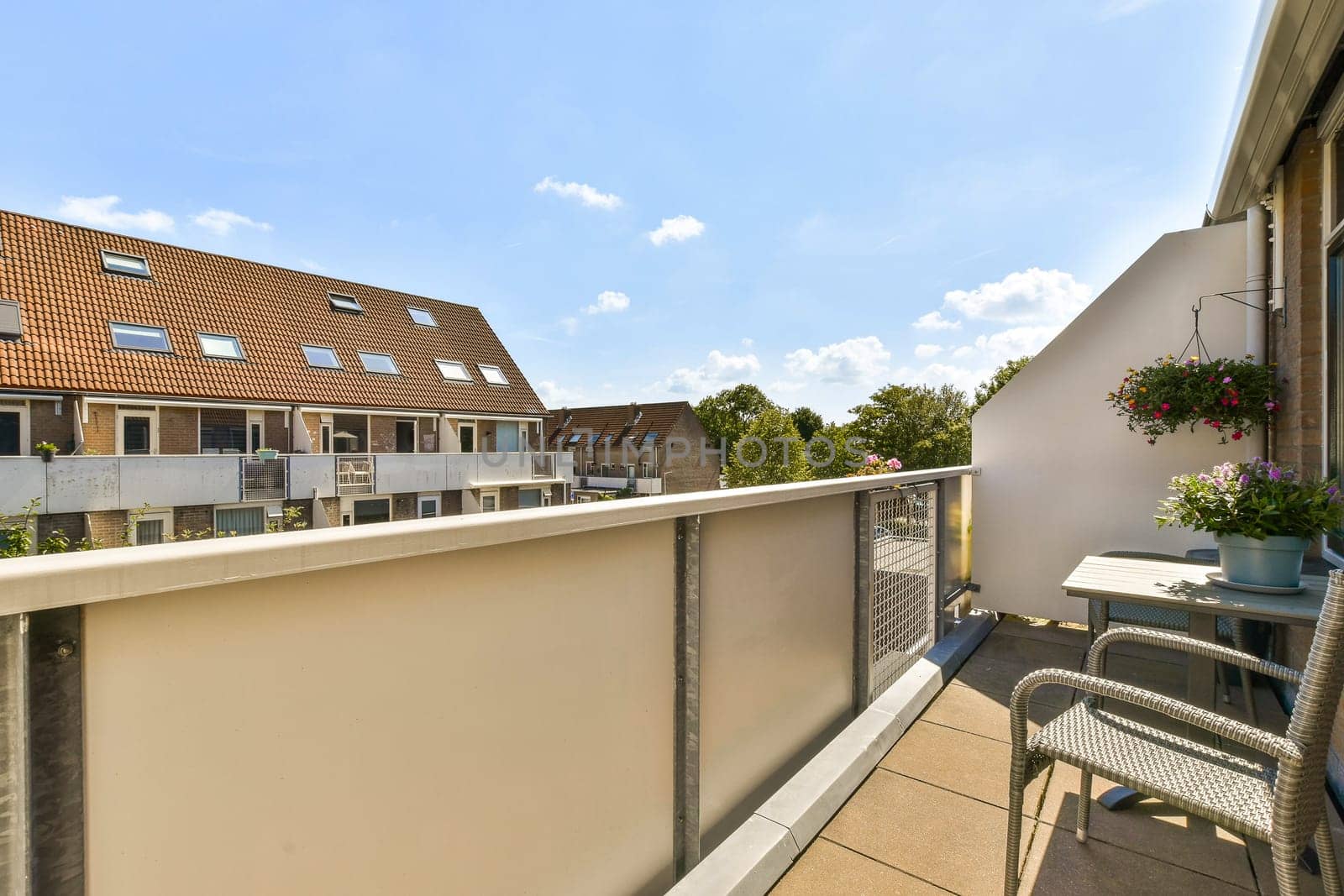 a balcony with a table and chairs and a view by casamedia