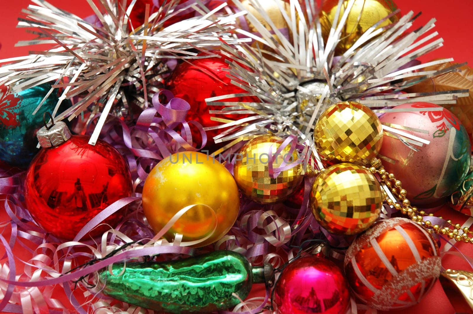 Various Christmas decorations on the red background
