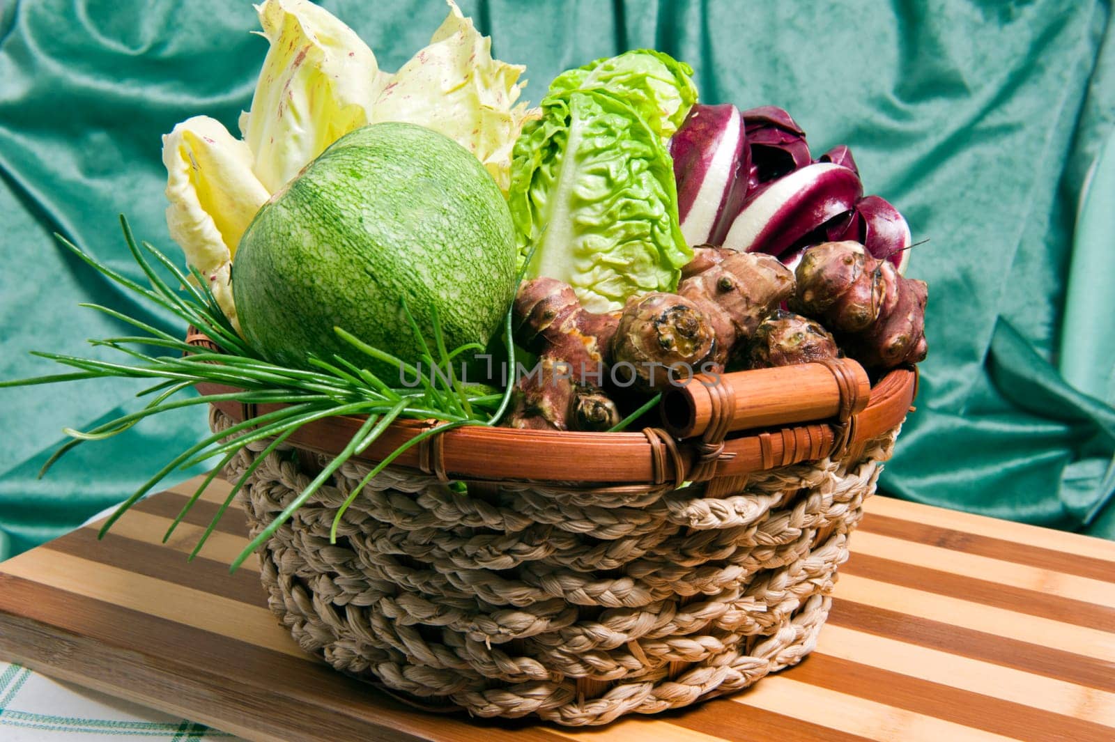 fresh salad on wooden cutting board bamboo
