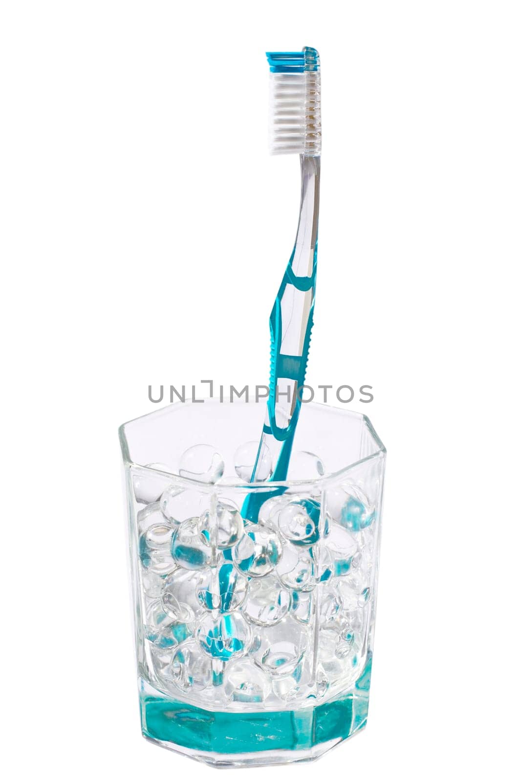 Turquoise toothbrush in a glass jar