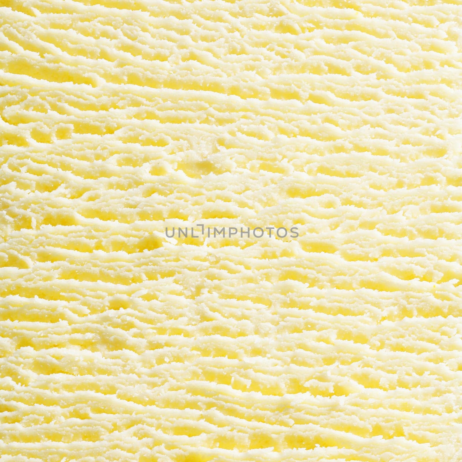 Macro abstract background of the surface texture of scoop of fresh creamy frozen vanilla icecream in square format. For ice-cream concept look at my portfolio