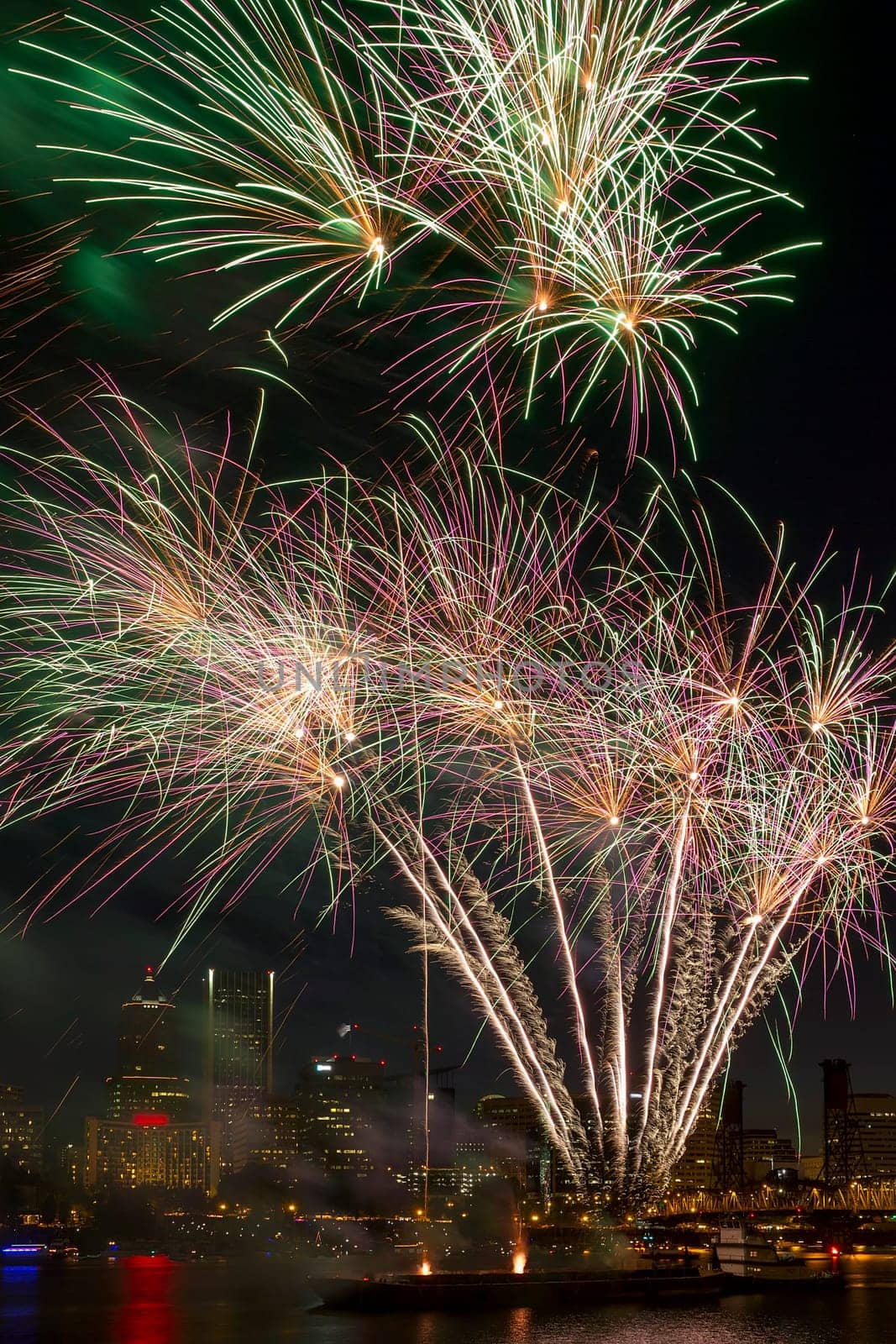 Fireworks Display Along Willamette River with Portland Oregon Skyline at Night