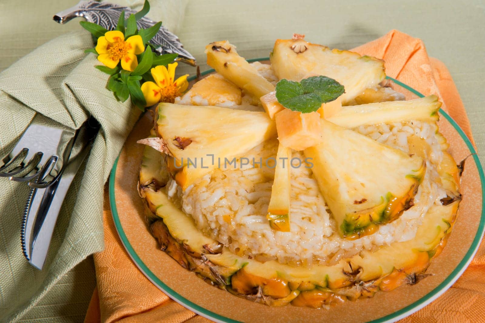 Rice pudding with pineapple on a green background