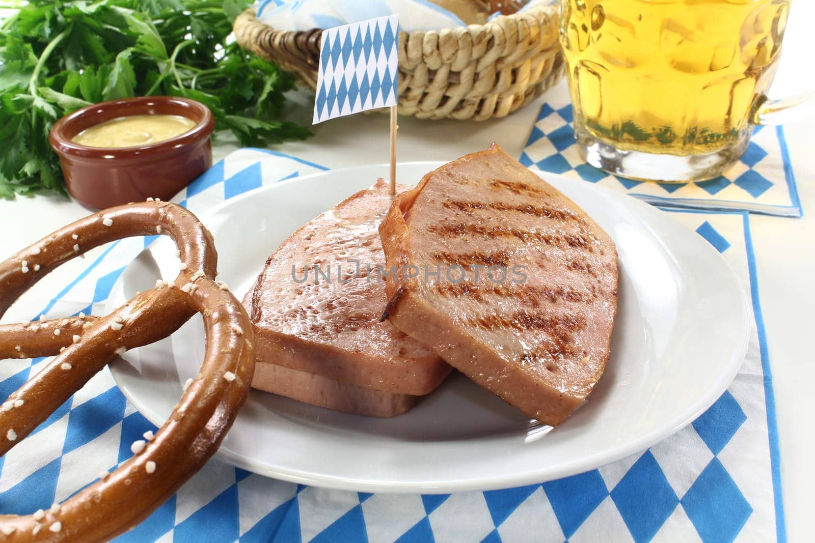 a pretzel with meatloaf and parsley
