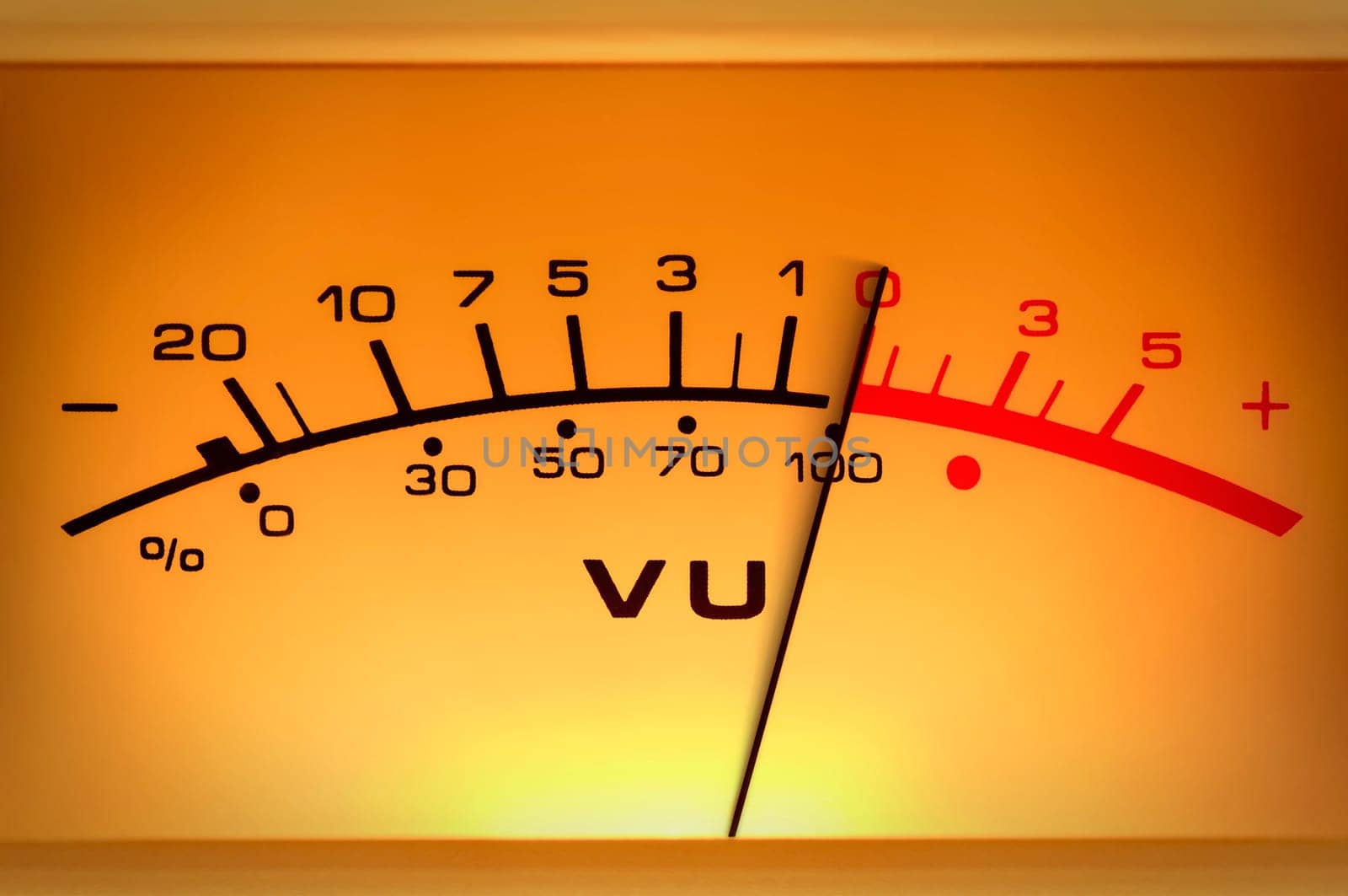 Close-up of an analog measuring instrument with red pointer in motion