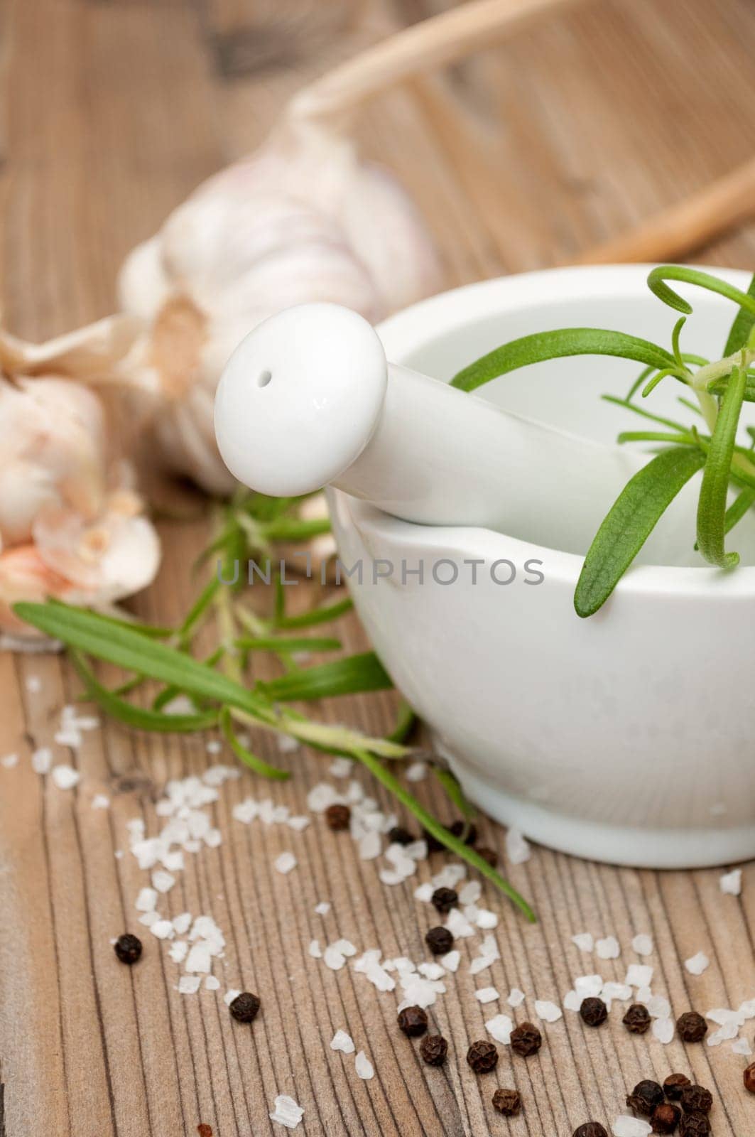 Mortar and Pestle With Ingredients - Rosemary, Salt, Pepper and Garlic