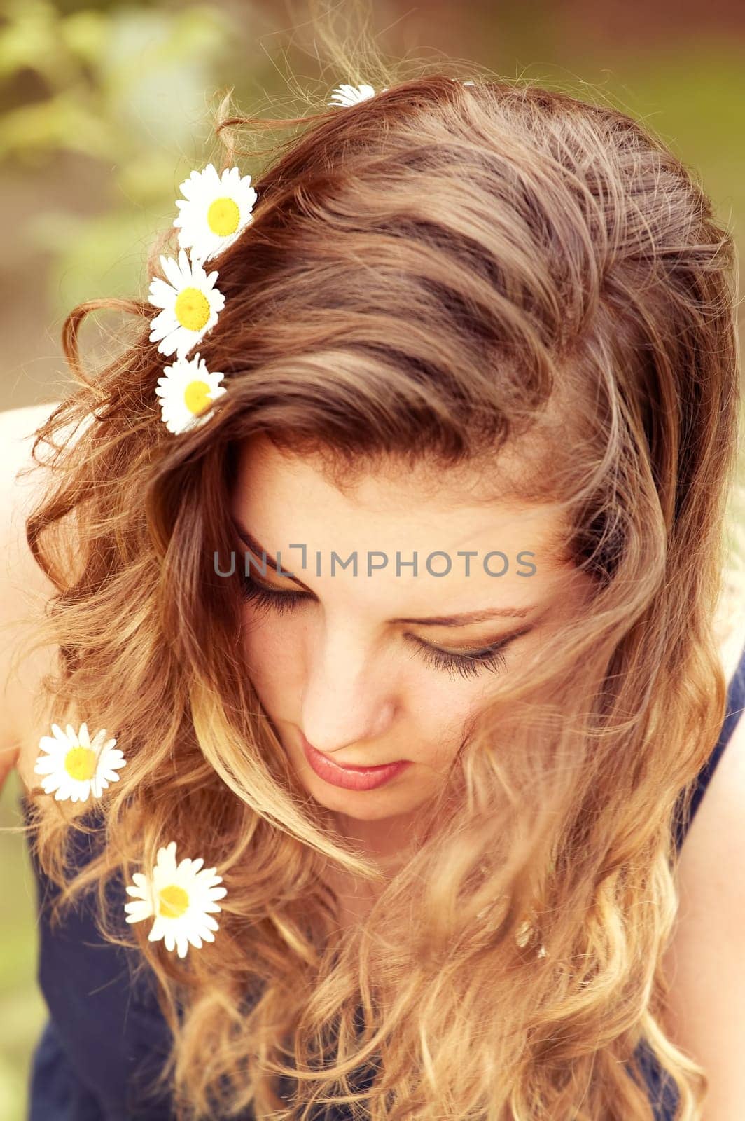 Portrait of a beautiful 20 year old woman enjoying a summer day outdoor.