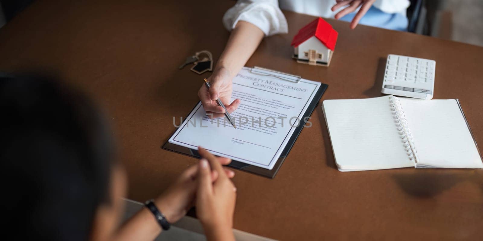 Real estate agent to his discussion and consult about house contracts client after signing contract, concept for real estate, moving home or renting property.