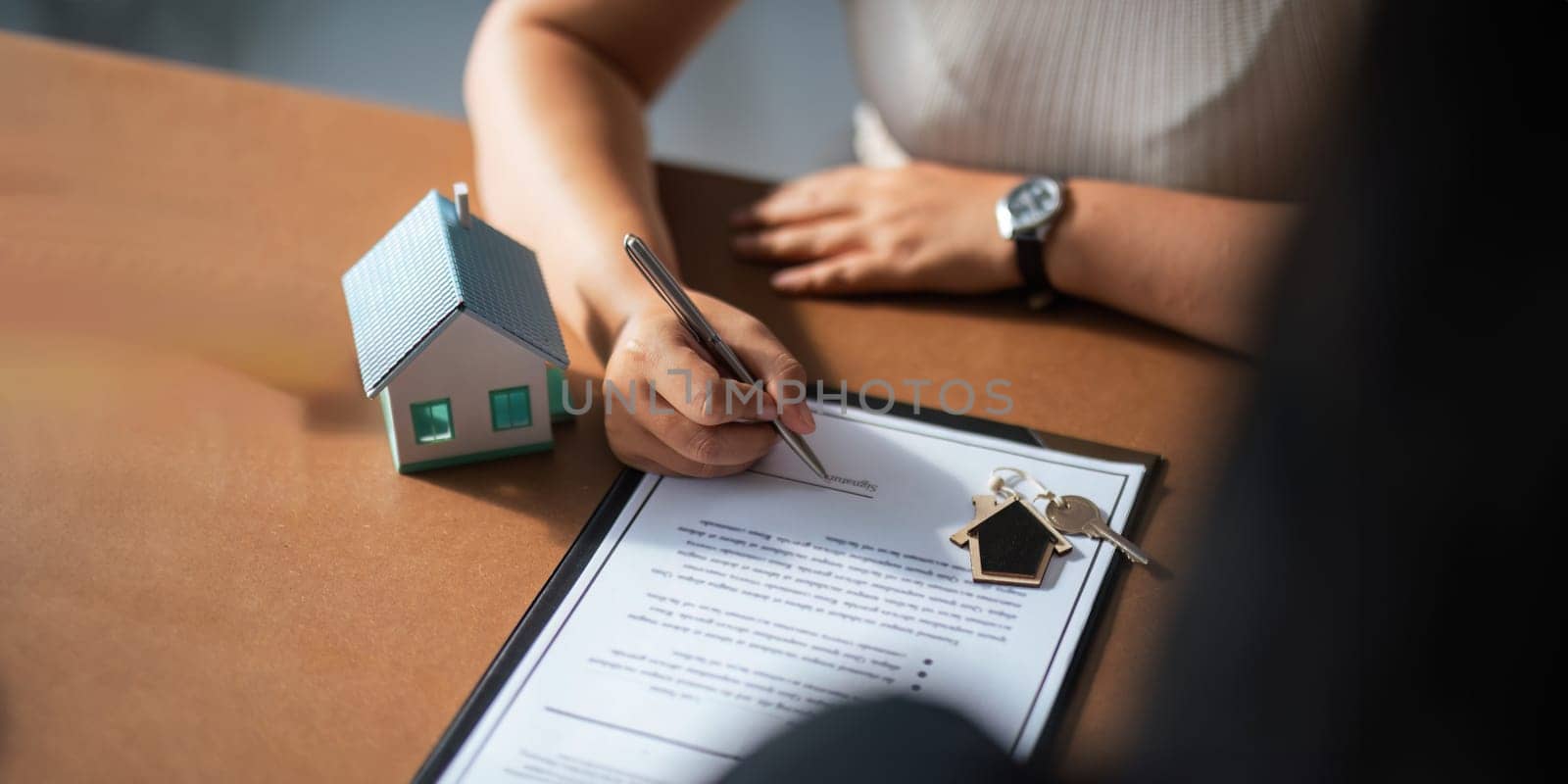 Real estate agent to his discussion and consult about house contracts client after signing contract, concept for real estate, moving home or renting property by nateemee
