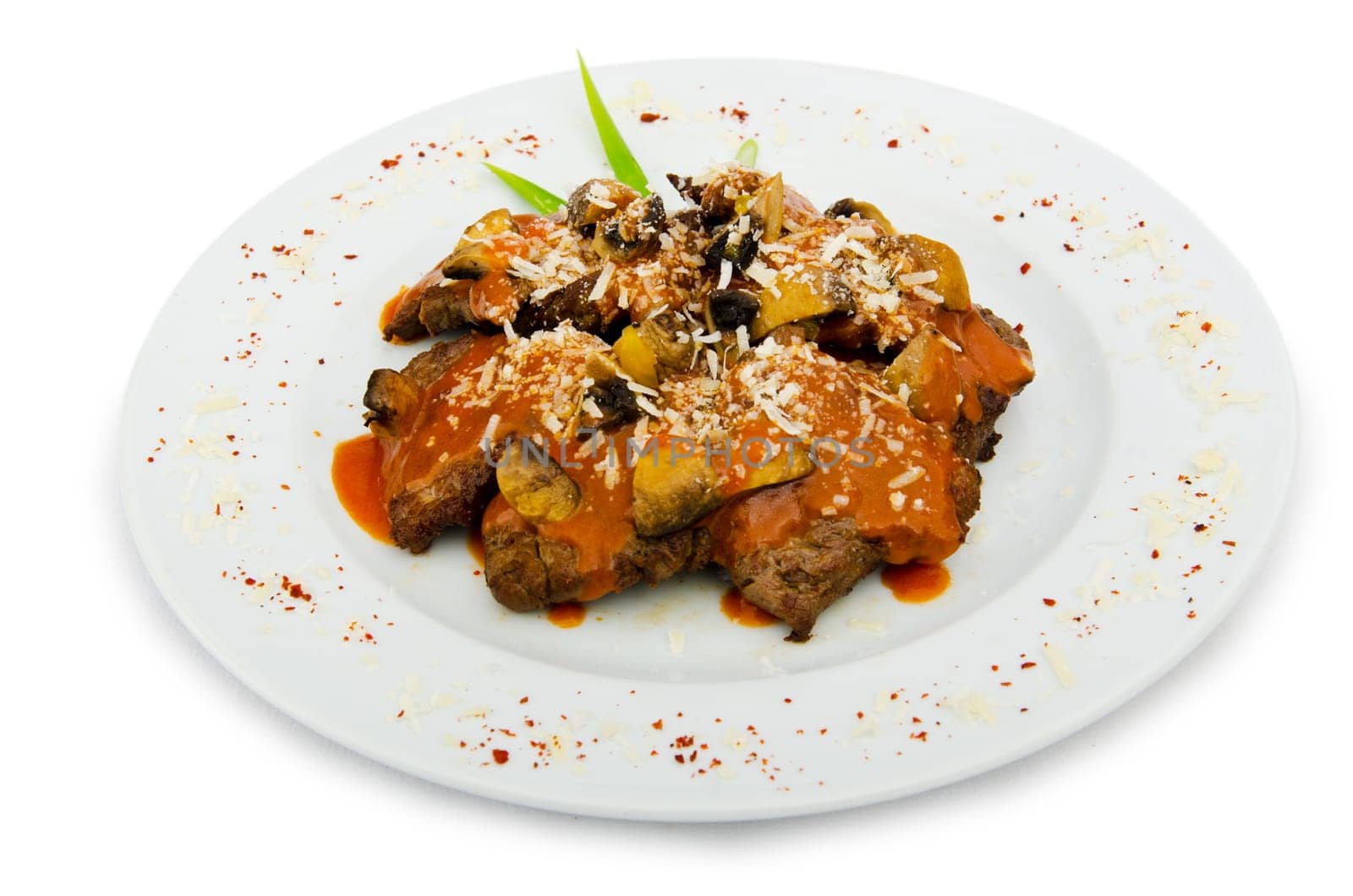 Meat under tasty sauce in plate
