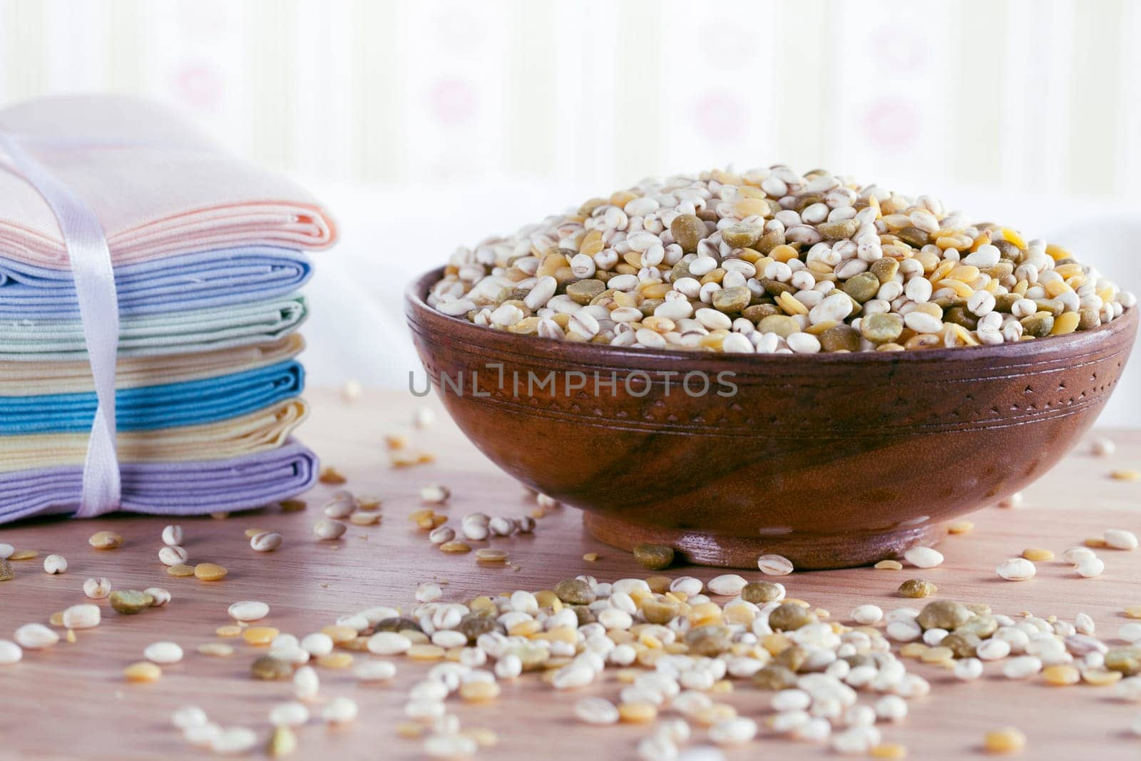 Bowl of healthy mixure of barley and greena and yellow lentils.