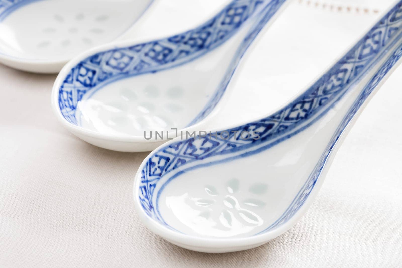 Porcelain chinese spoon with blue hand painted decoration.