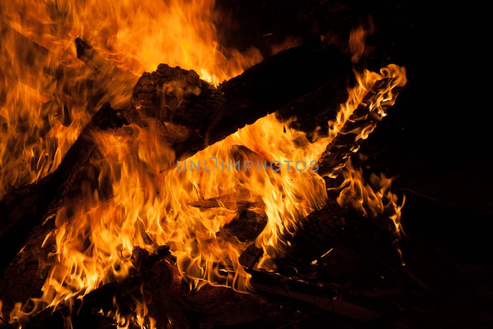 Large campfire in which boards burn