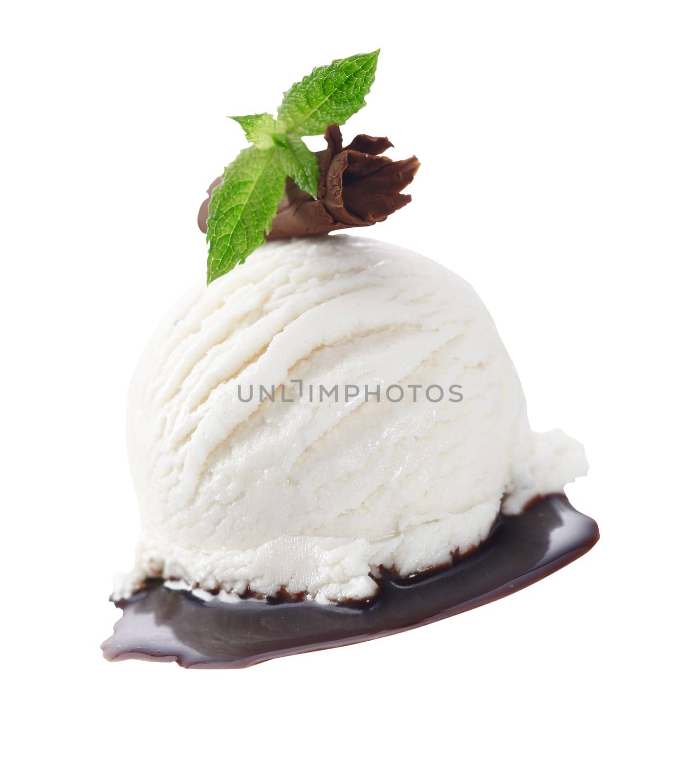Scoop of creamy vanilla icecream served with chocolate sauce and garnished with a rolled shaving of milk chocolate and mint leaves