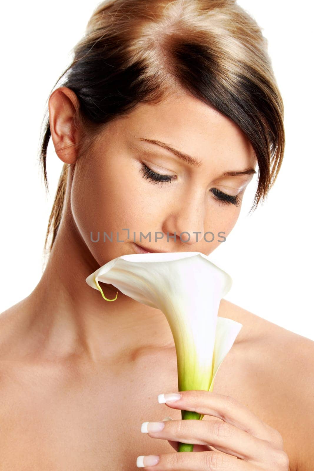 Beautiful young girl with flower against white background