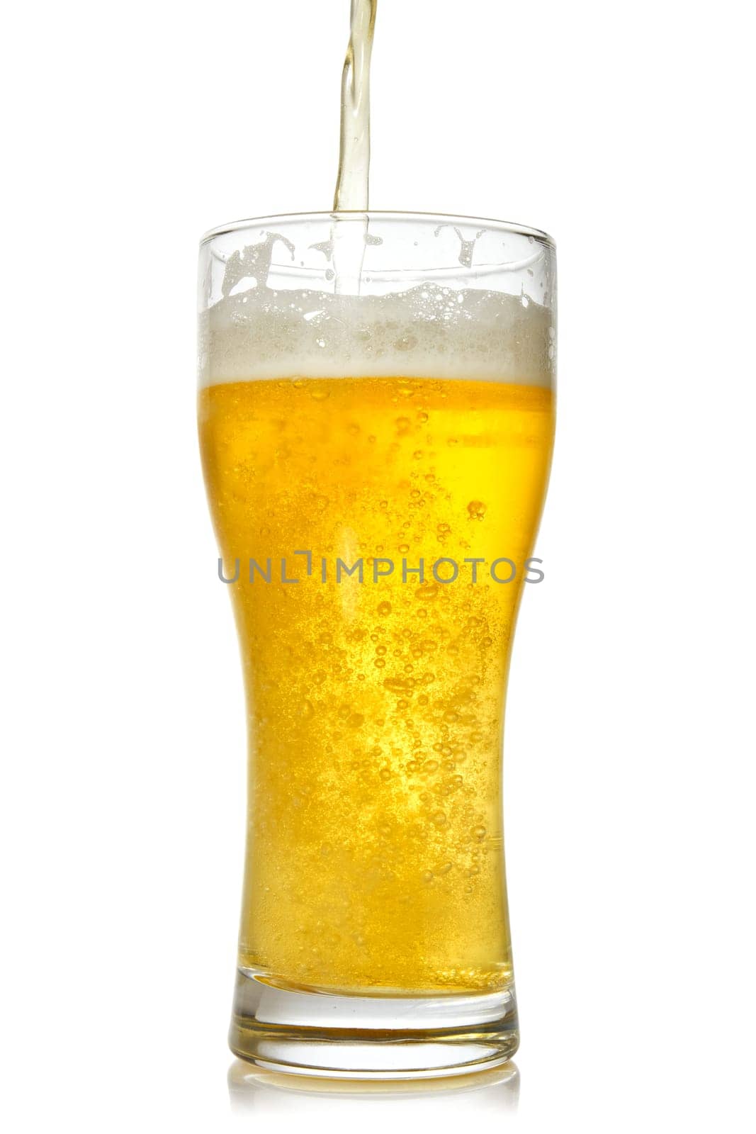 Cold beer pouring into glass. Isolated on white background