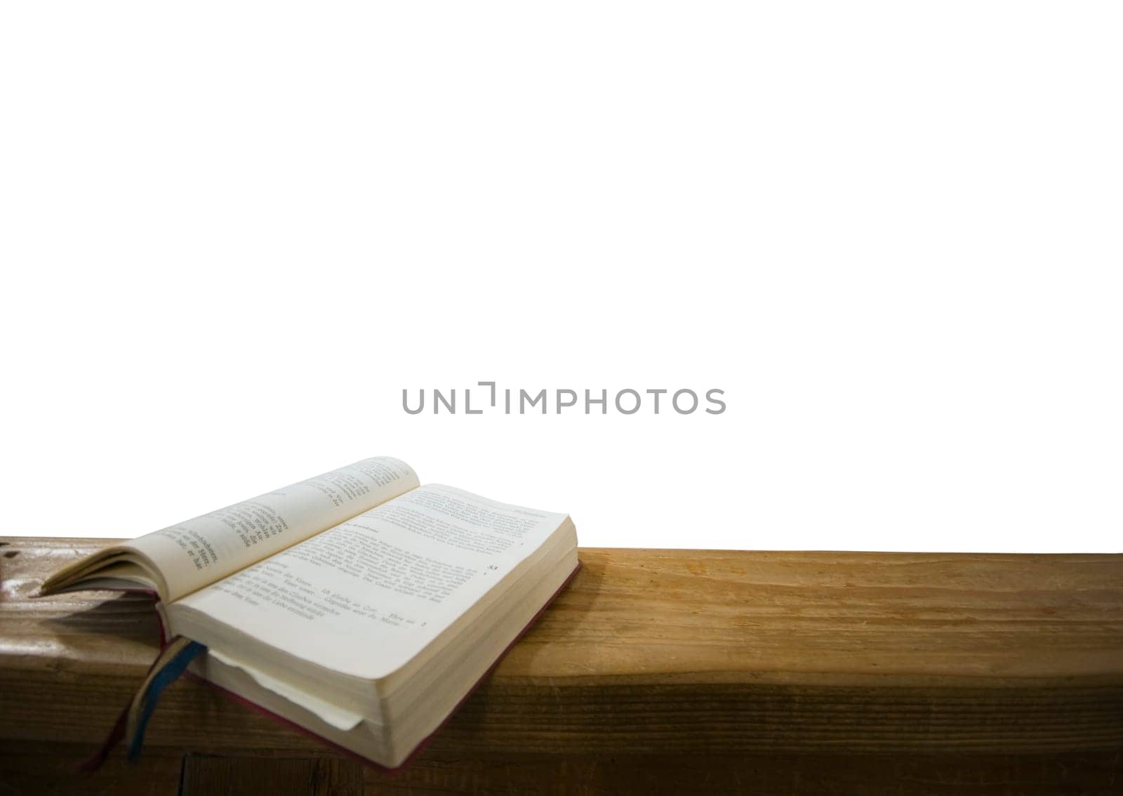 Open hymnal on wooden base and white background