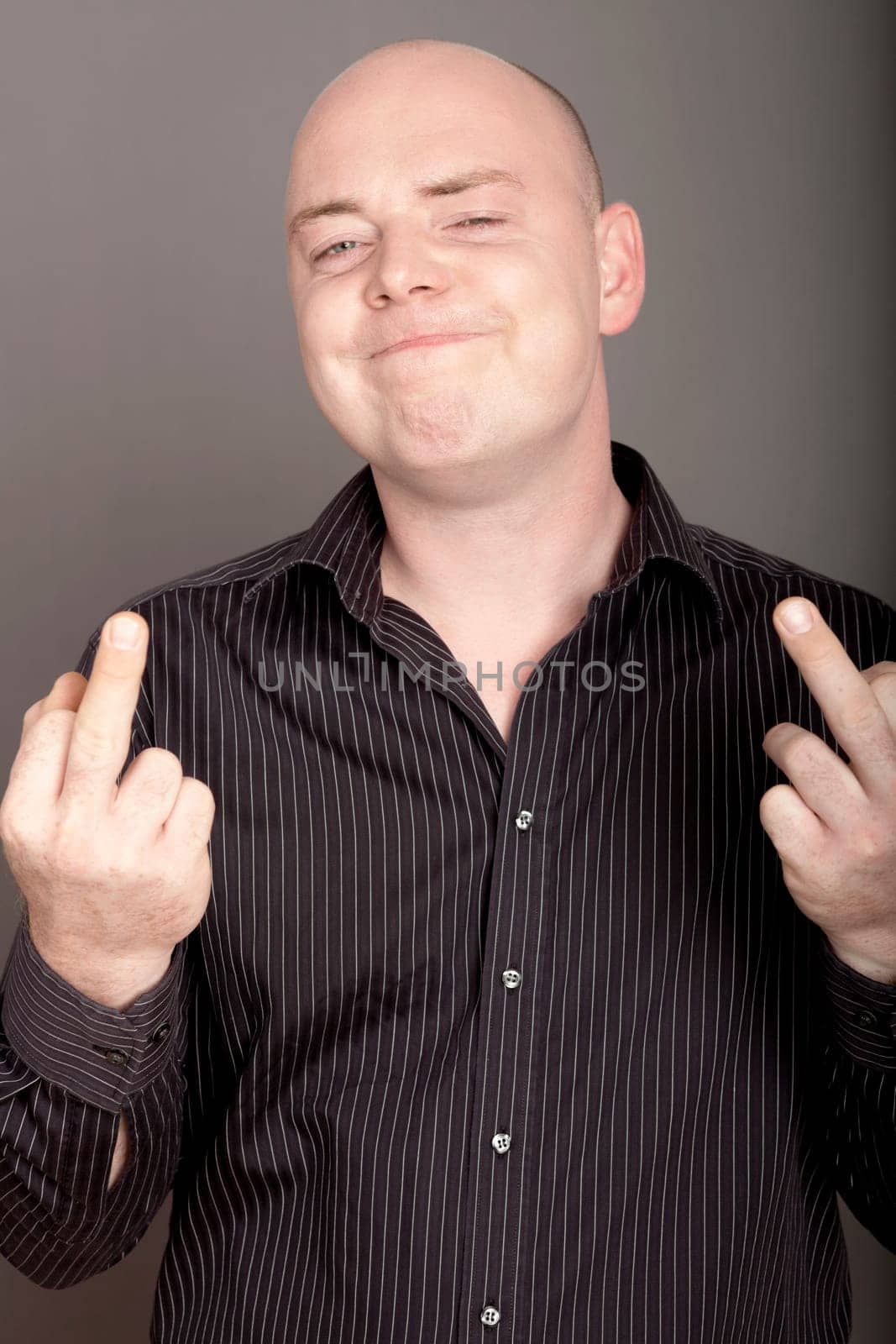 bald man on white background with middel finger