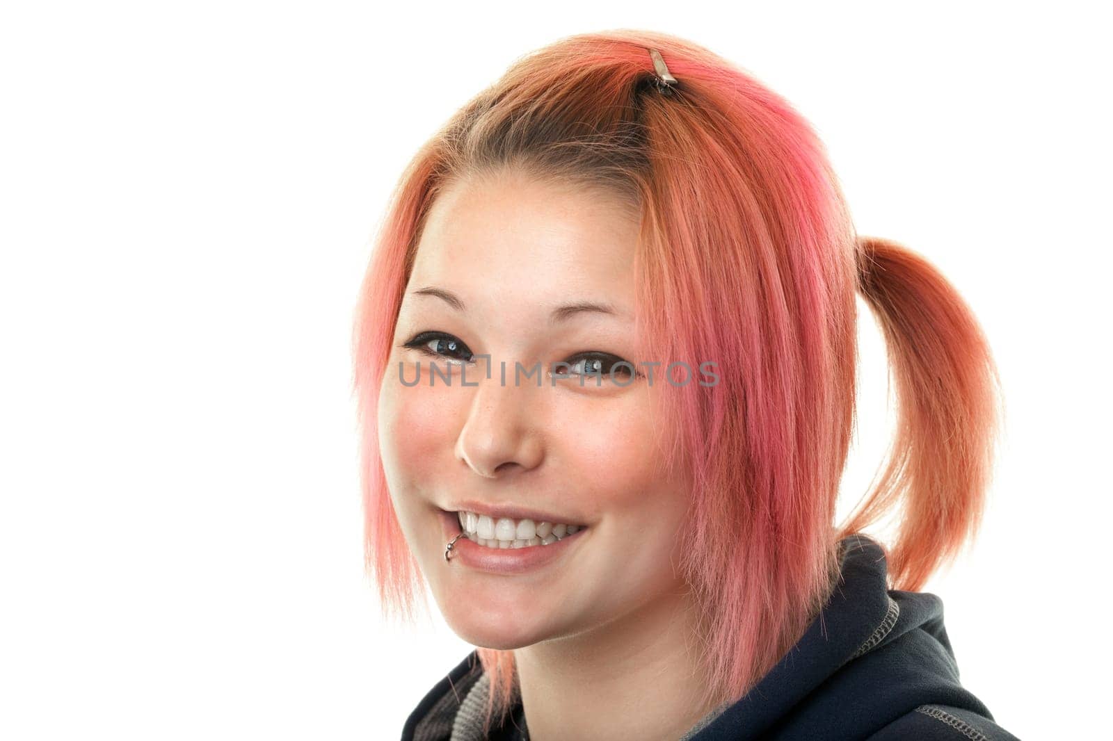Portrait of teenager with piercing,studio shot against white background