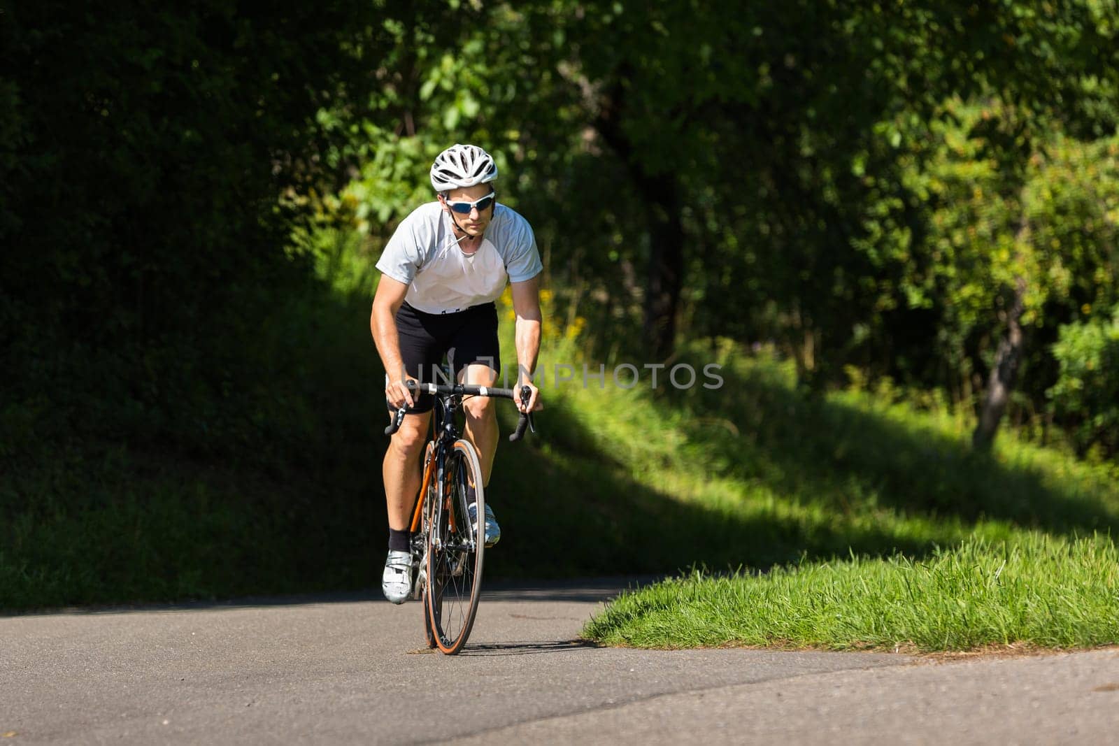 Road cyclists pedaling out of the saddle