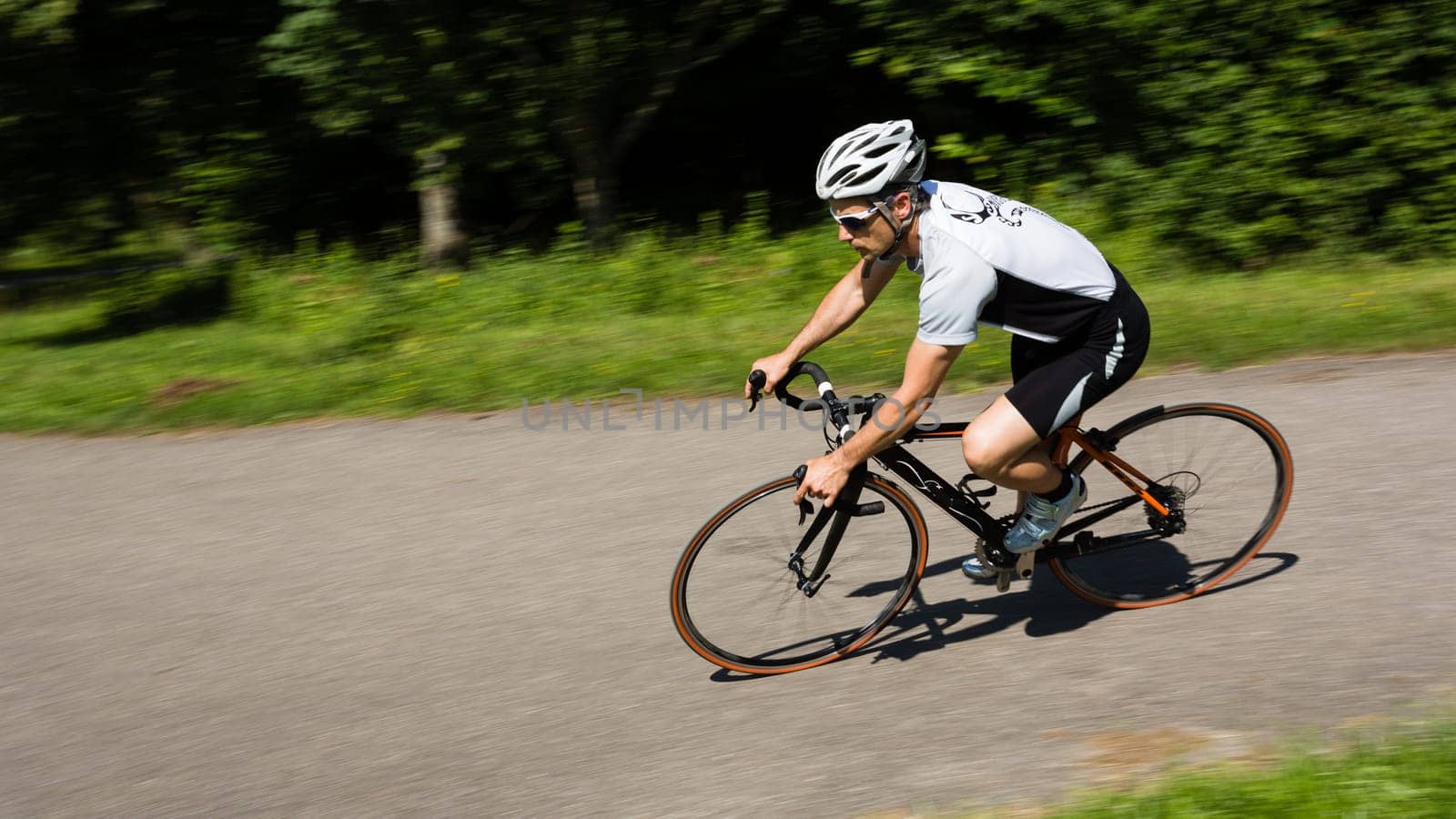 Road cyclist in motion blur
