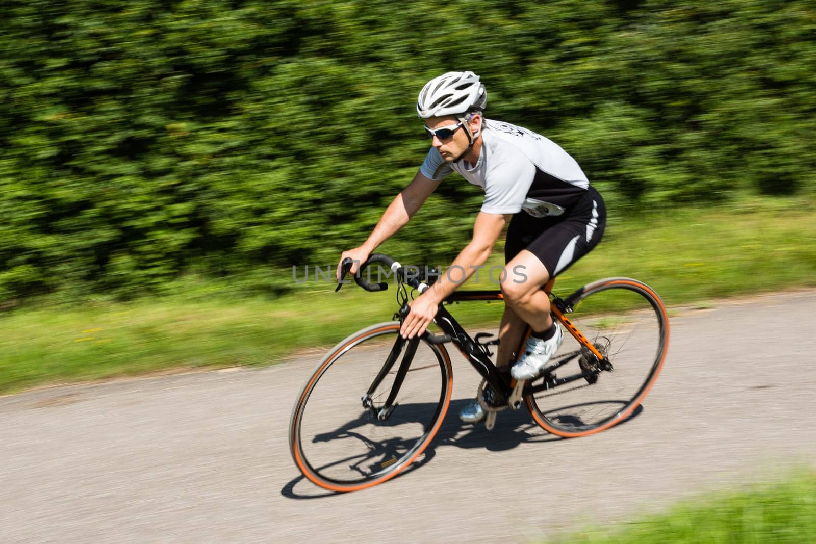 Road cyclist in motion blur