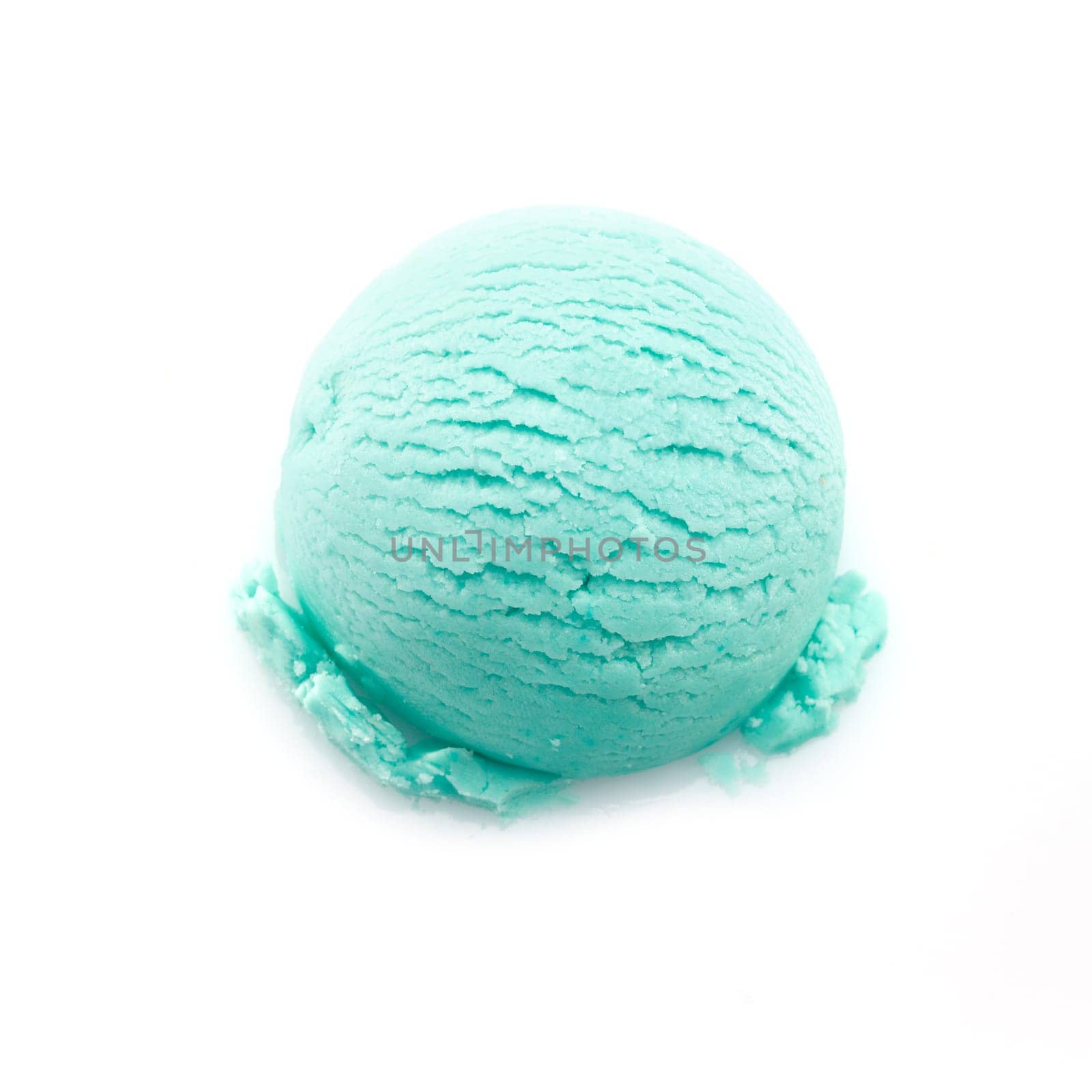 High angle view on a scoop of turquoise ice cream isolated on white background