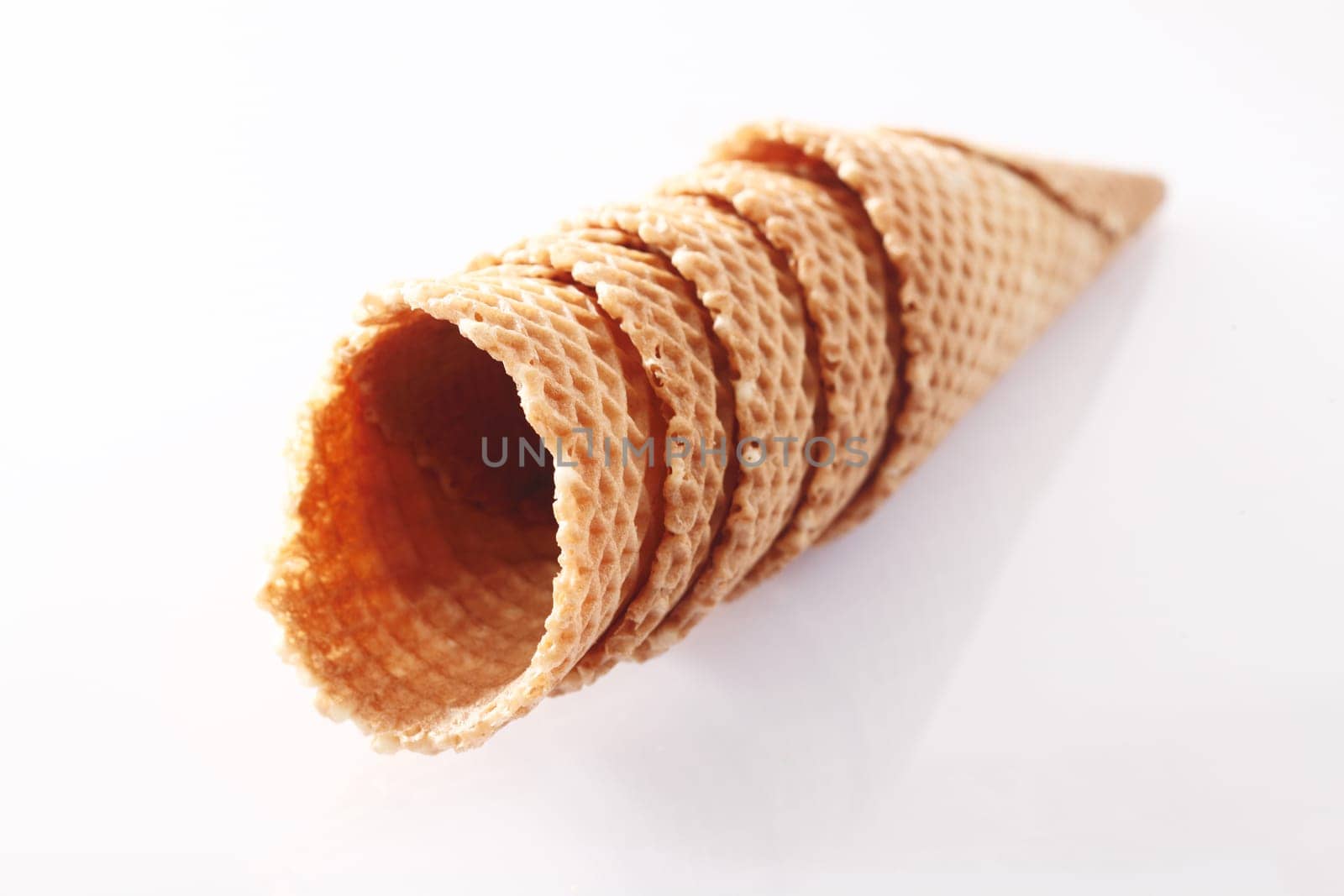 Riffled ice-cream cones on white background, for parlor food concepts