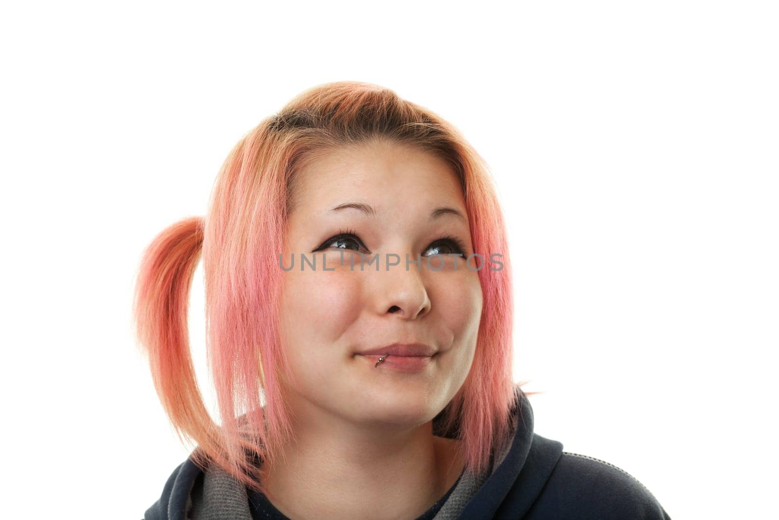Looking up,teenager with red hair against white background