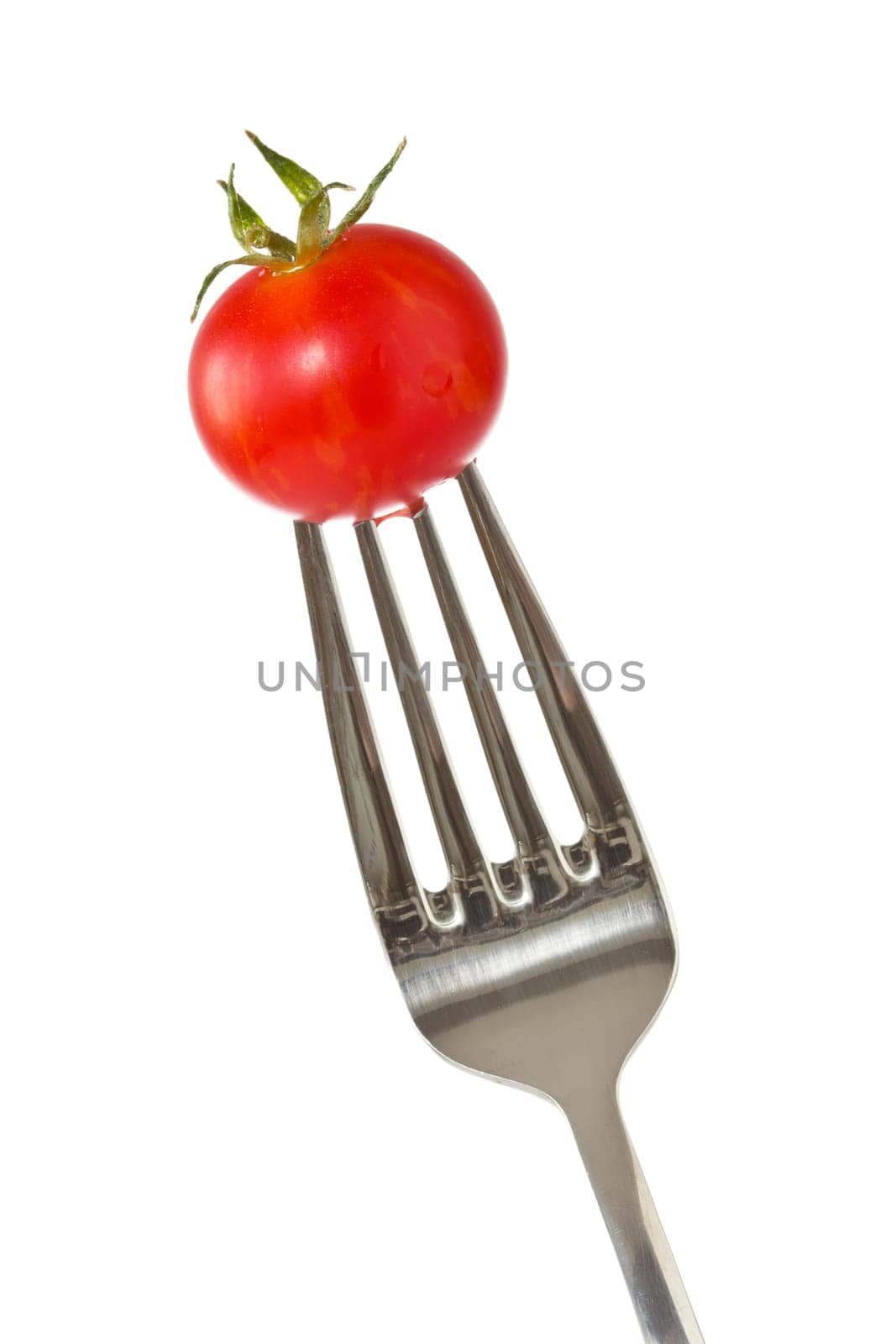 Fork with a  little red tomato.Isolated on white background