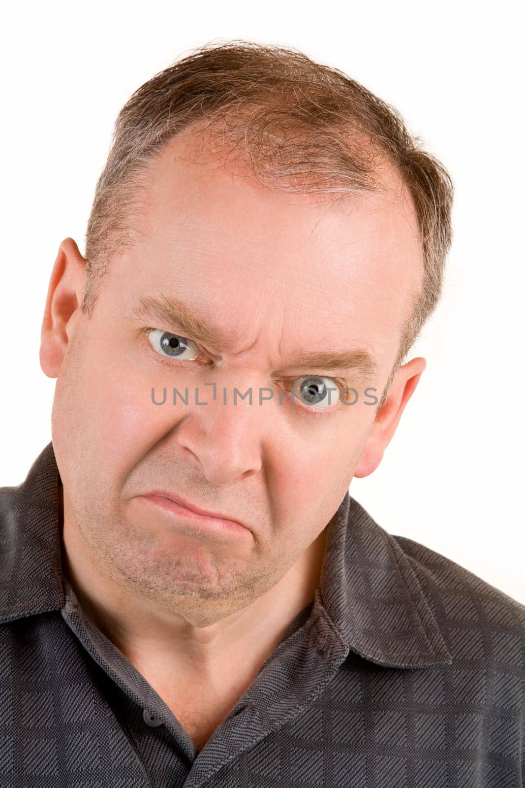 This is a portrait of a grumpy middle aged man.