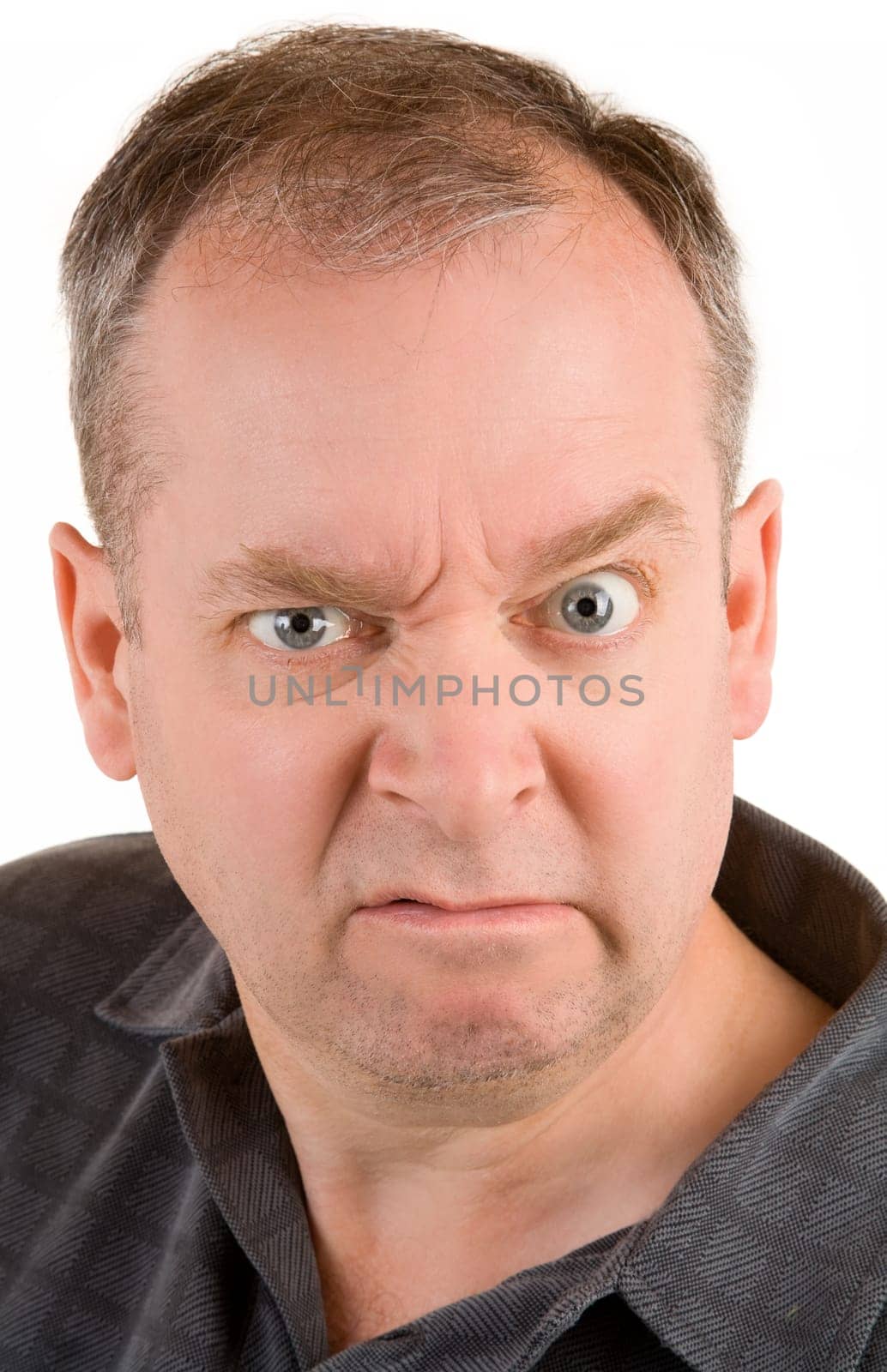 This is a portrait of a grumpy middle aged man.