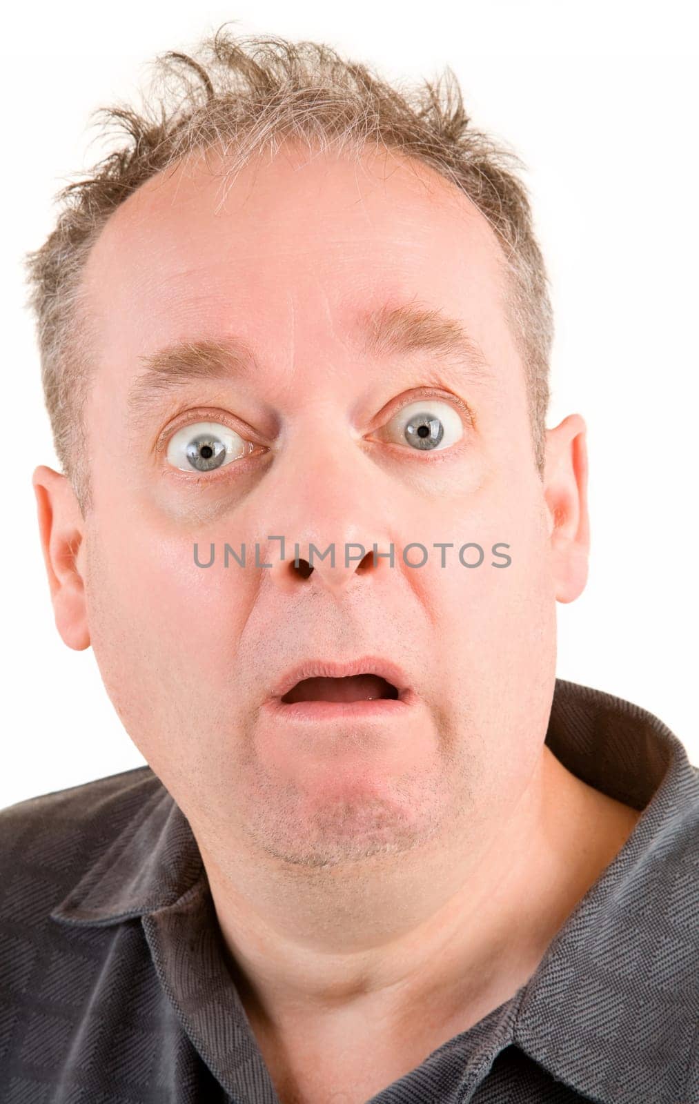 The face of a man being afraid of something.