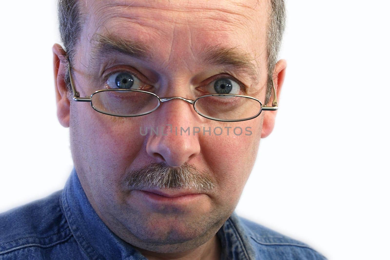 Man with glasses has a skeptical attitude.