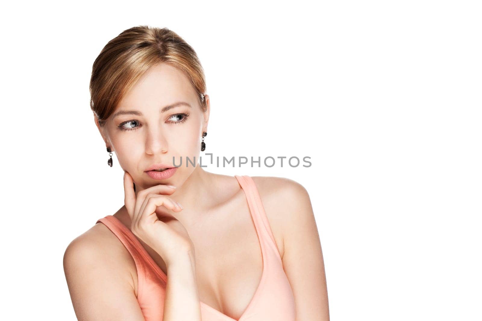 Thinking young beautiful blonde woman looking to the side against white background