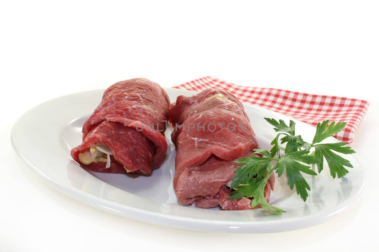raw beef roulade with bacon,onion and cucumber