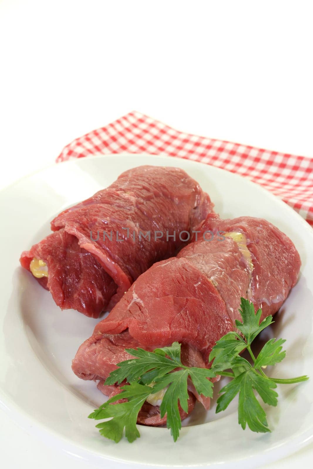 raw beef roulade with bacon,onion and cucumber