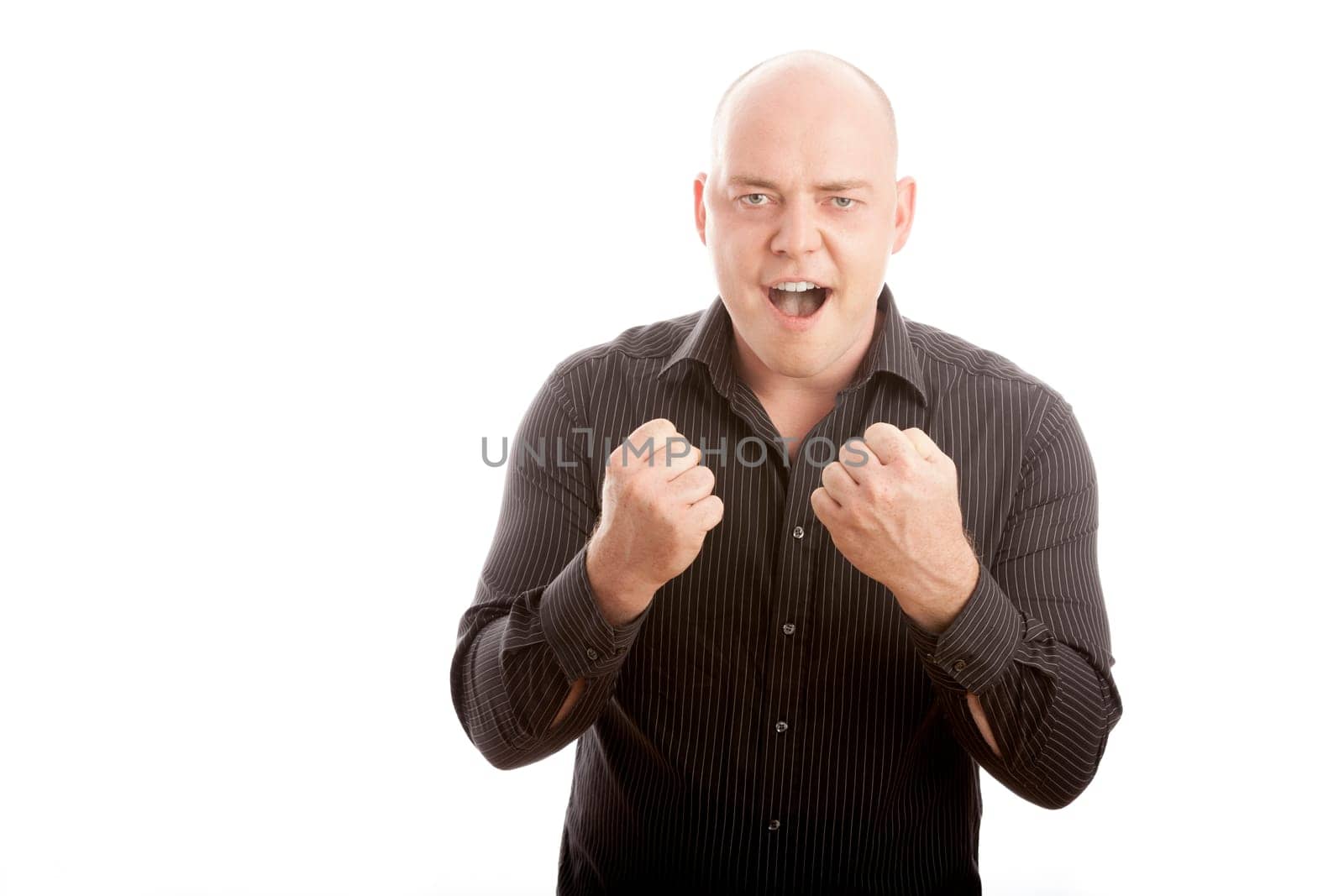 bald man win and scream with arms in the air