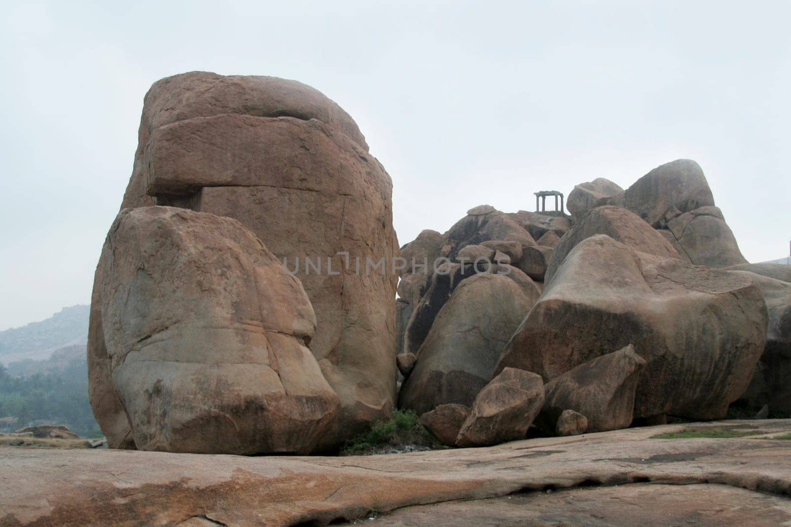 Huge rock boulders and watch tower on Hemakoota Temples Hill at Hampi, Karnataka, India, Asia
