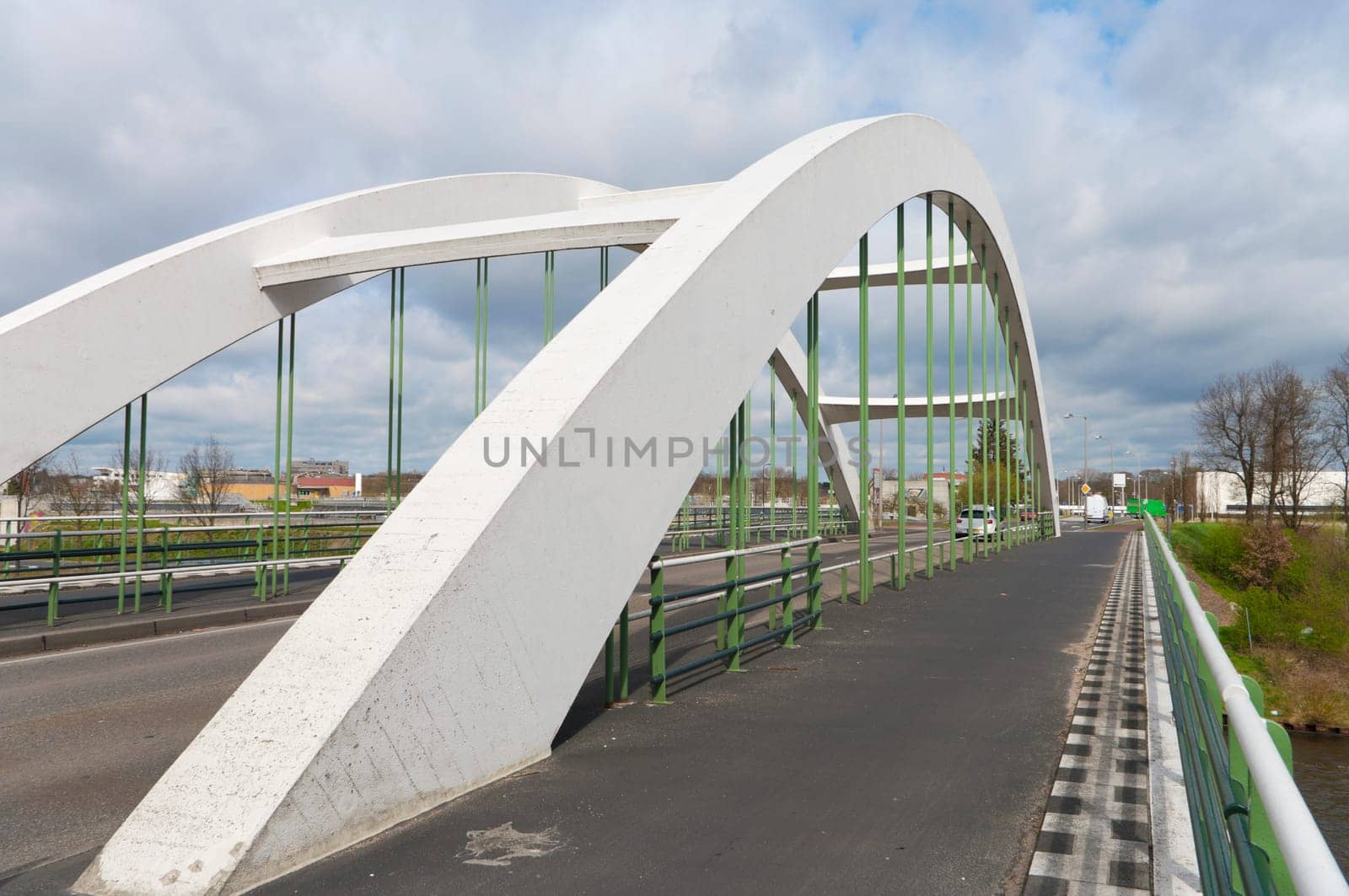 concrete white arch bridge in Enschede, Netherlands