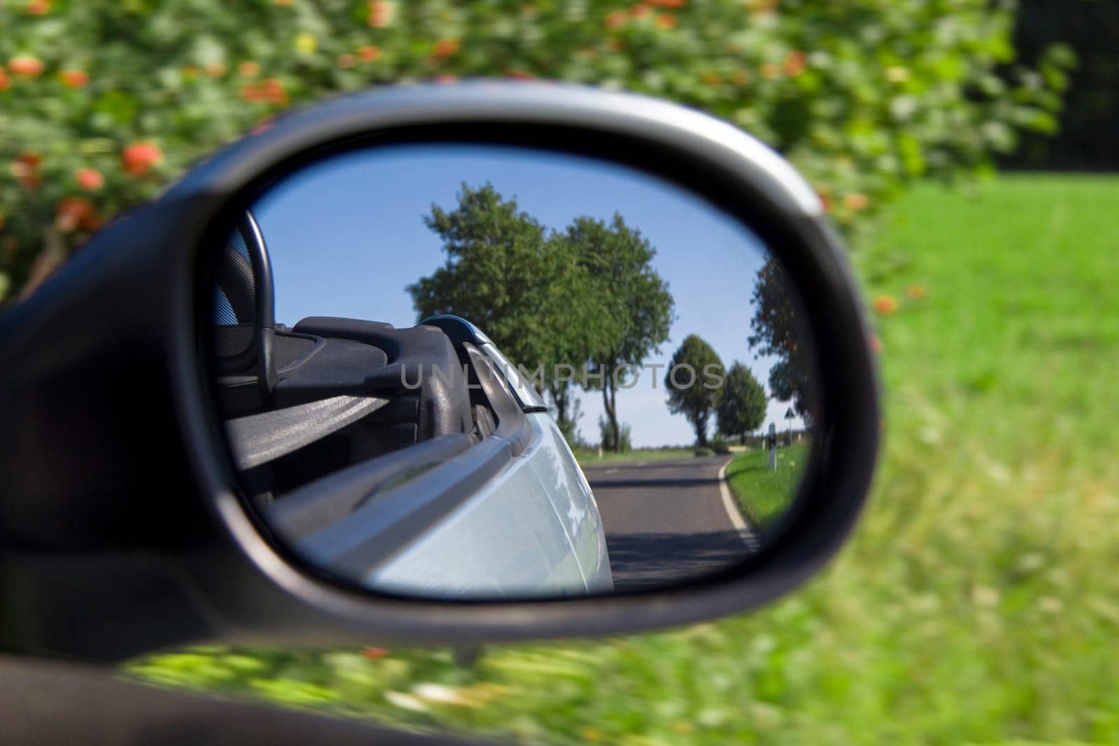 The ride in the convertible - look in the side mirror