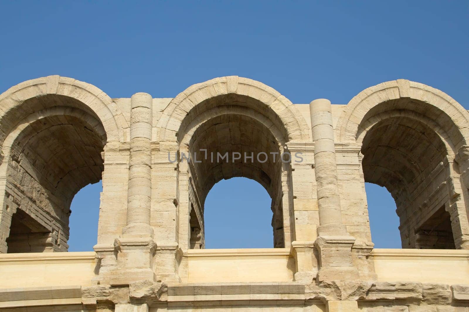 View of the antique amphitheater and arena of Arles in South France (Provence). Horizontally.