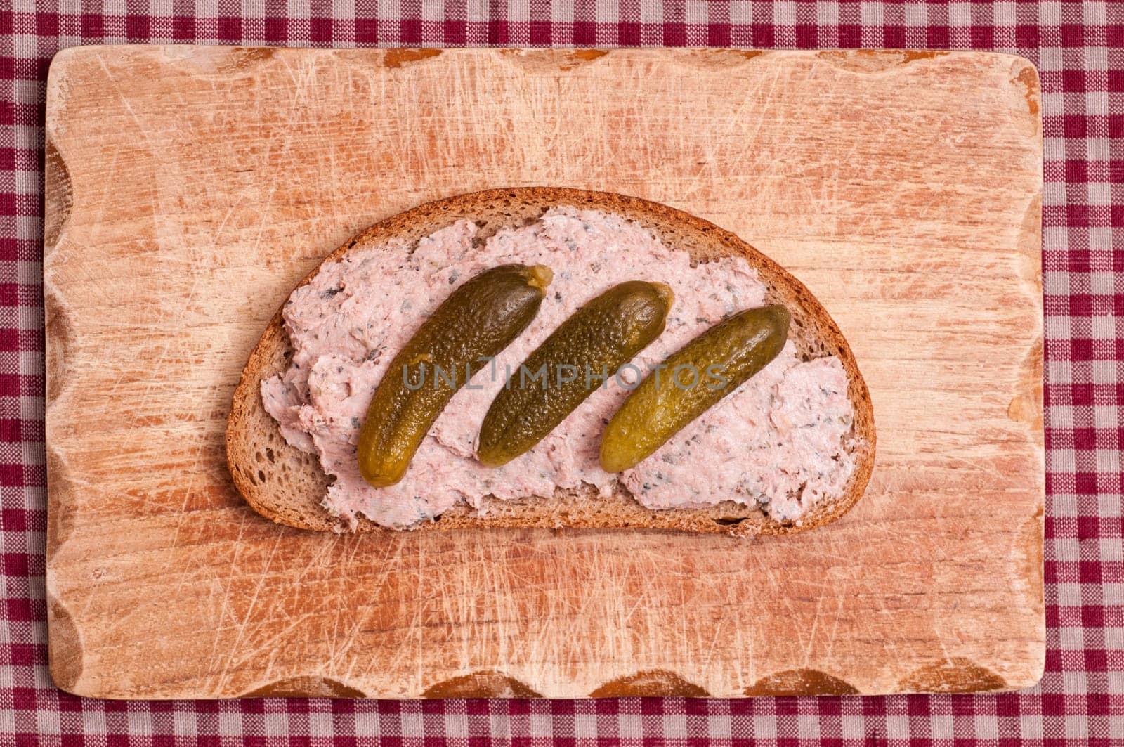 Sausage bread with pickles on a snack board