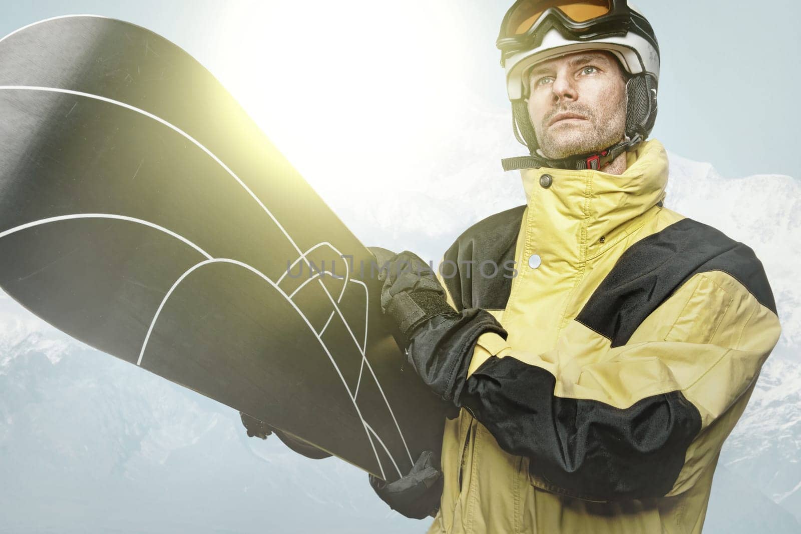 Snowboarders in the mountains with backlight