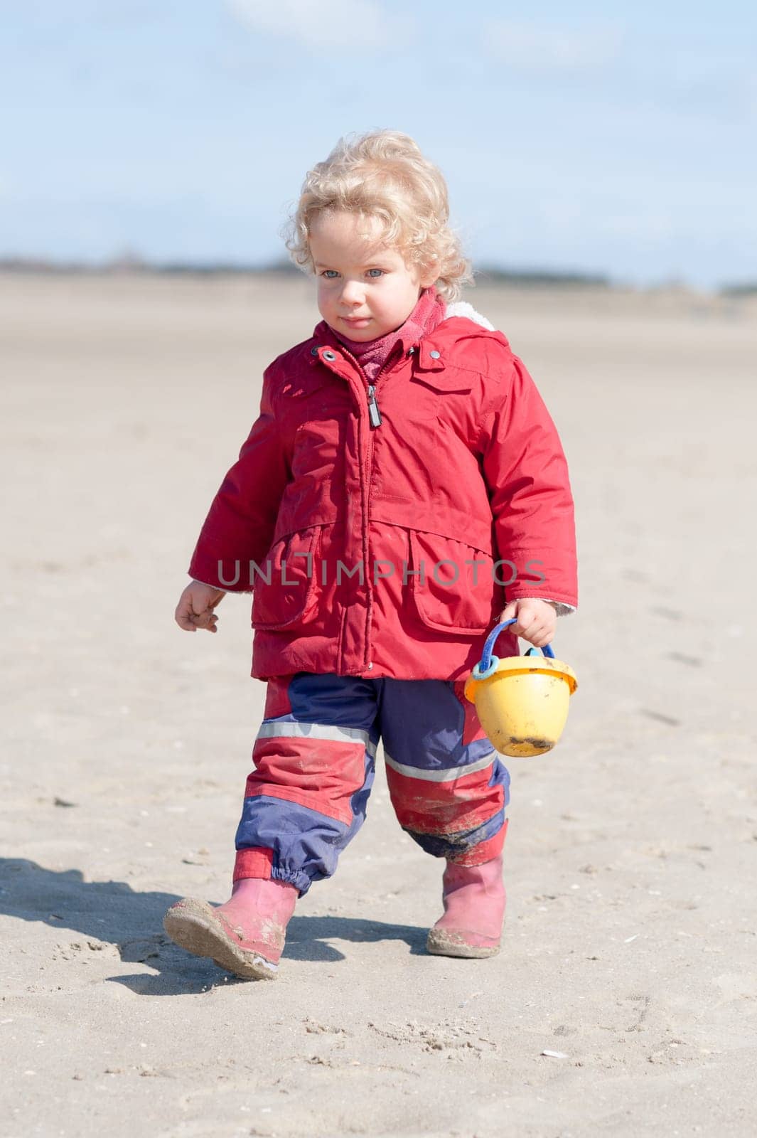 Toddler running on the beach
