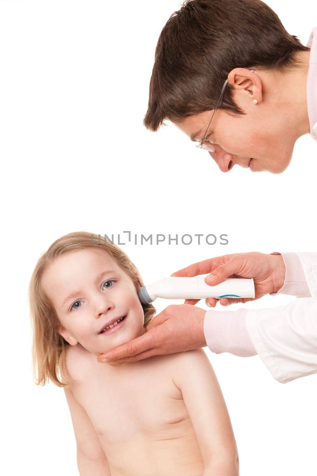 Toddler at pediatrician in front of white background
